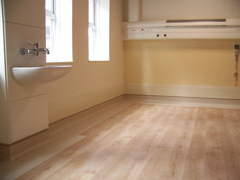 EasyClean integrated with coved vinyl flooring