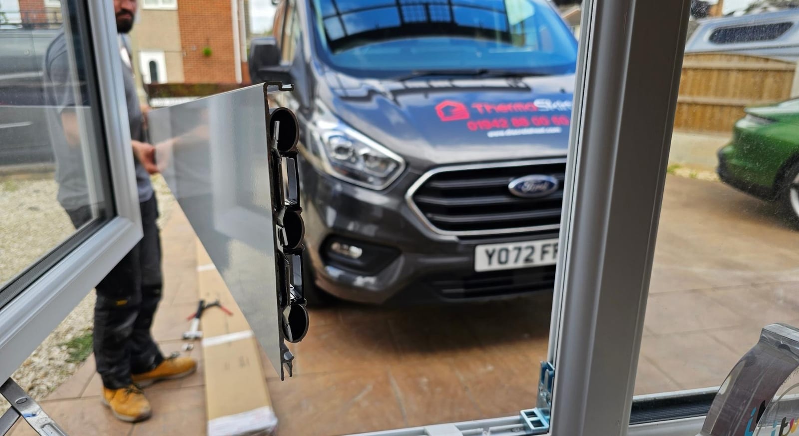 A ThermaSkirt-branded installer van and profile on a job
