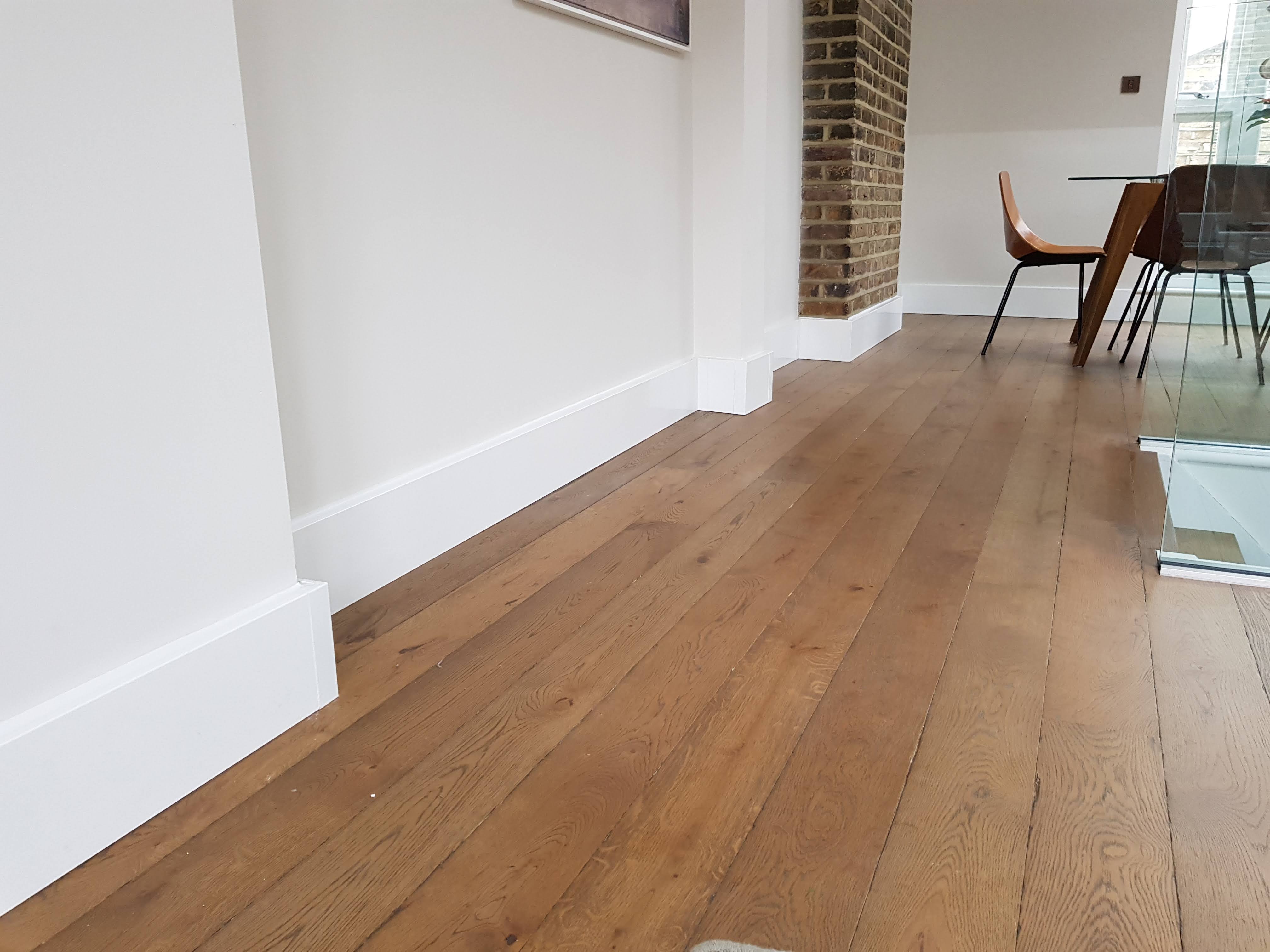 A 17th-century London living room heated by ThermaSkirt after the radiator was removed