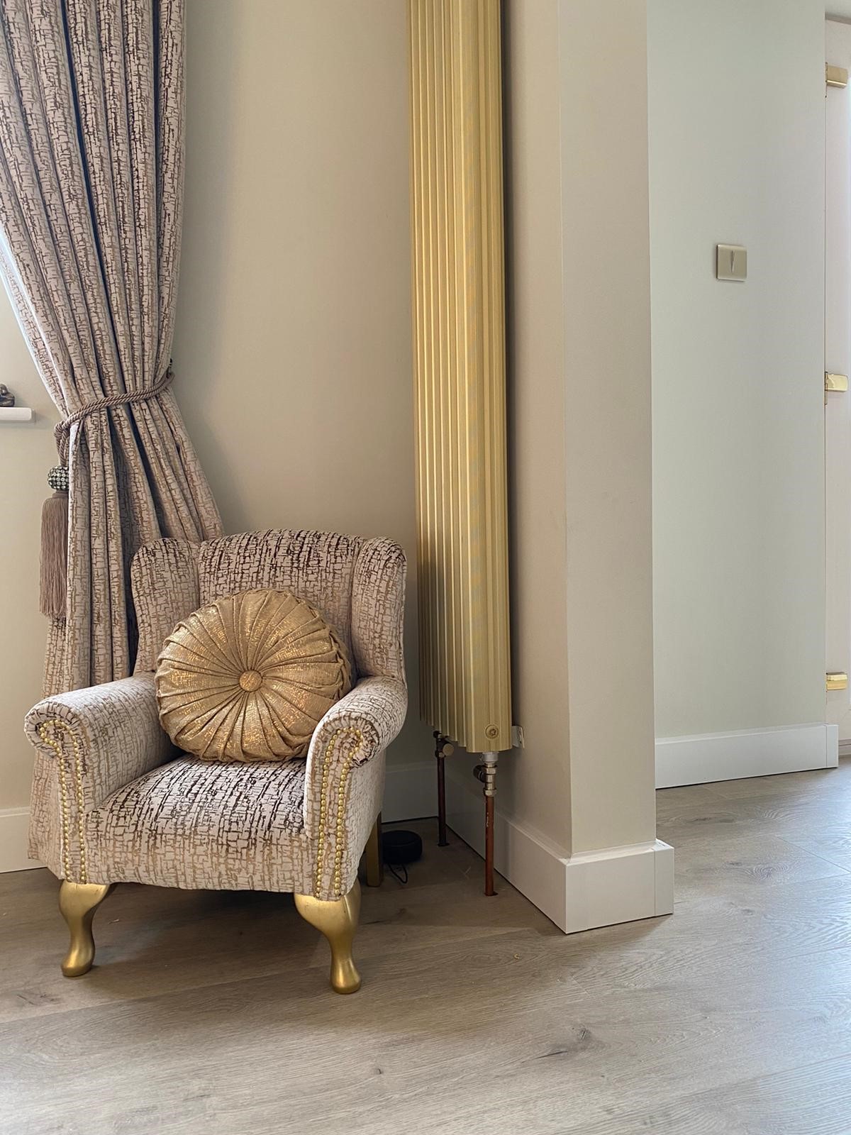 A modern interior showing clean walls with ThermaSkirt installed at skirting level