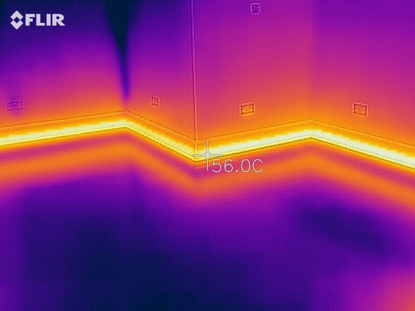 ThermaSkirt radiant skirting installed around a room perimeter