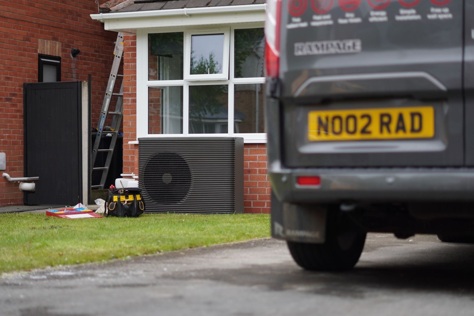 An air-source heat pump installed outside a new home