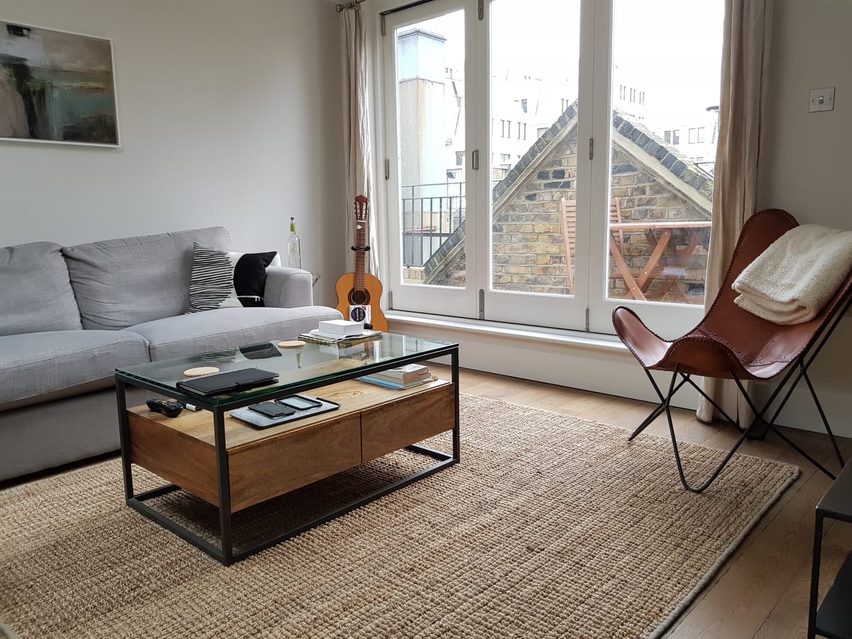 ThermaSkirt Deco BM3 running around the perimeter of a lounge in an 18th-century listed property above original oak floors