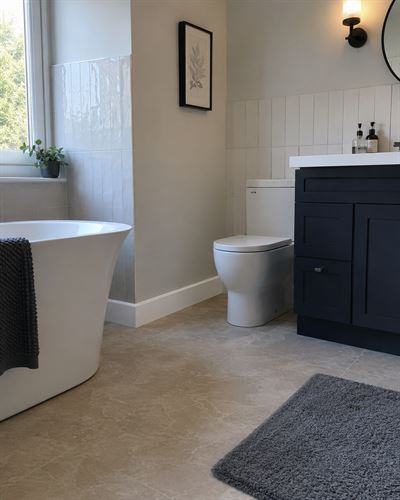 Bathroom with ThermaSkirt running along the base of the walls