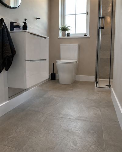 Bathroom with ThermaSkirt running along the base of the walls