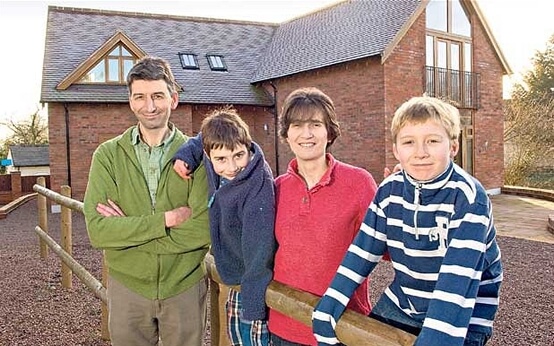 Eco fans: Mark and Lucy Edwards with their boys Jacob and Nathaniel, who built an eco house in the garden of their Georgian home