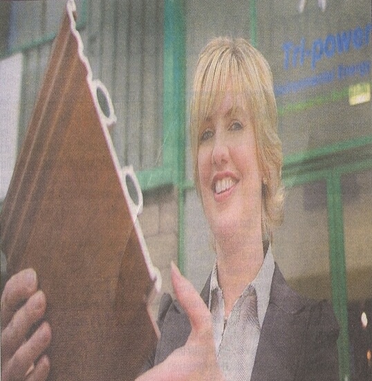 The heat is on for failed product : Elaine Hutton, demonstrates a section from the ThermaSkirt product which was put on show at Tri-Power Environmental Energy's new showroom at Westbank Business Park, Belfast