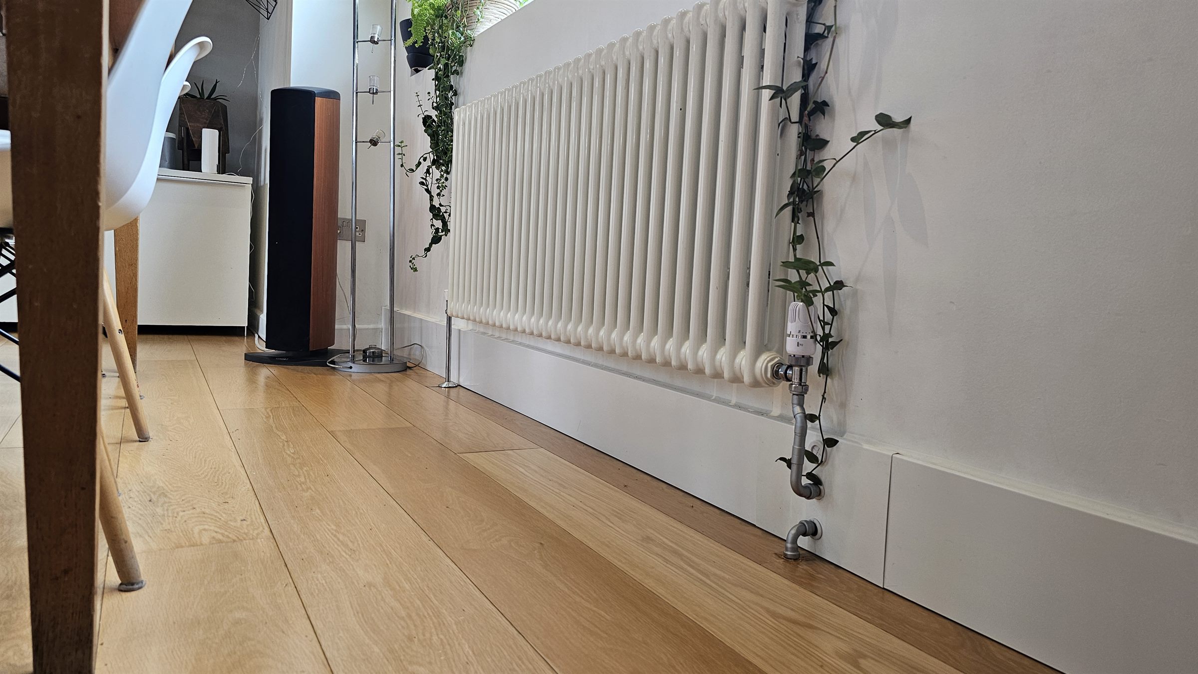 Add2Rad heated skirting run added in series to an existing column radiator in a heat-pump retrofit