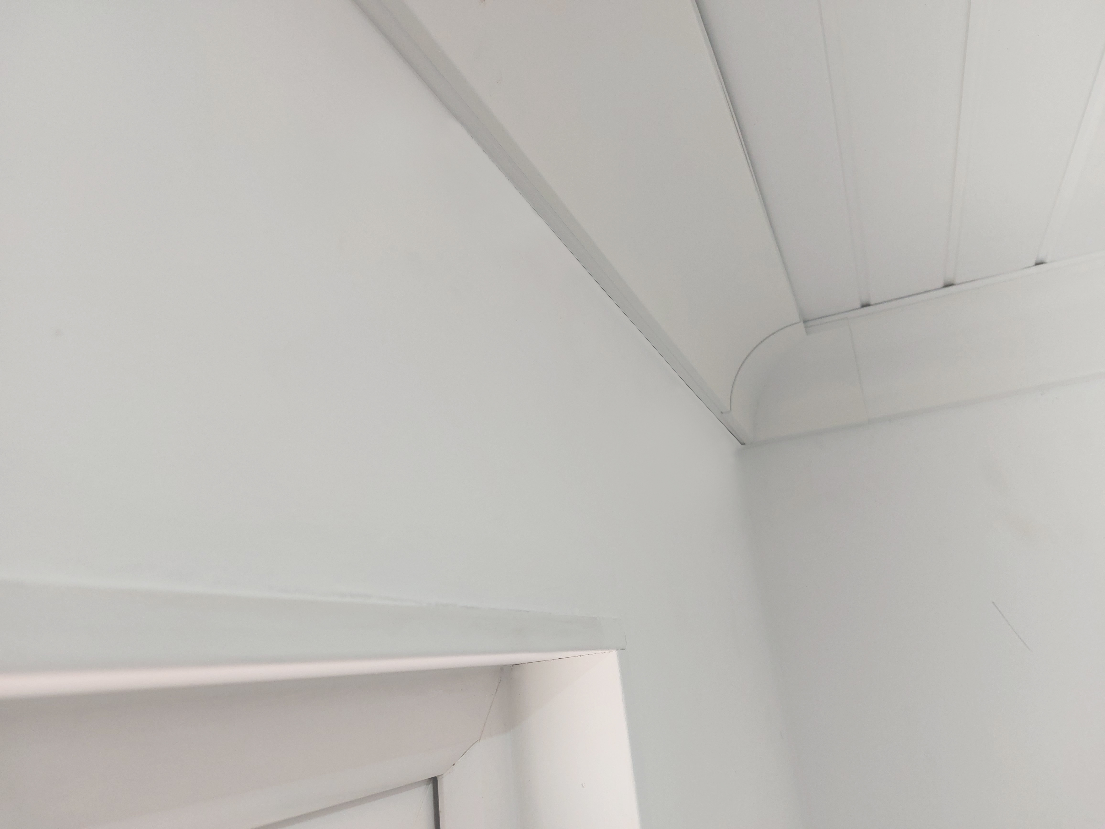 ThermaCurve running around a corner, painted to match the wall